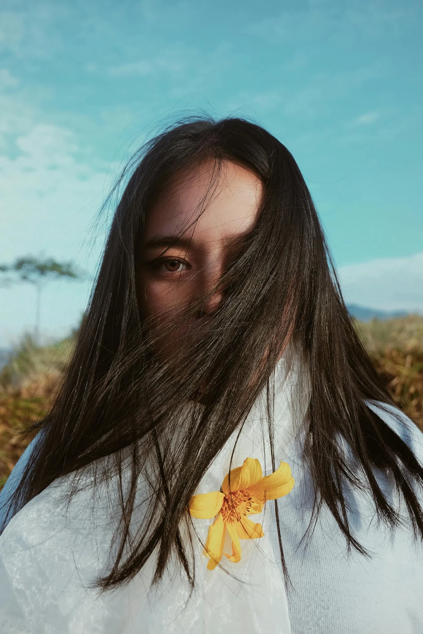 Clover & Thread new arrival social post, editorial portrait with yellow flower